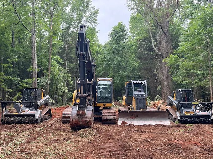 AAA Land Management equipment including excavator, bulldozer and forestry mulching attachments